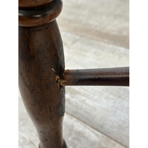 1002 - A 19th century yew wood and elm Windsor chair, stamped E. Gabbitass Worksop - approx. 88cm high x 47... 