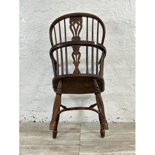 1002 - A 19th century yew wood and elm Windsor chair, stamped E. Gabbitass Worksop - approx. 88cm high x 47... 