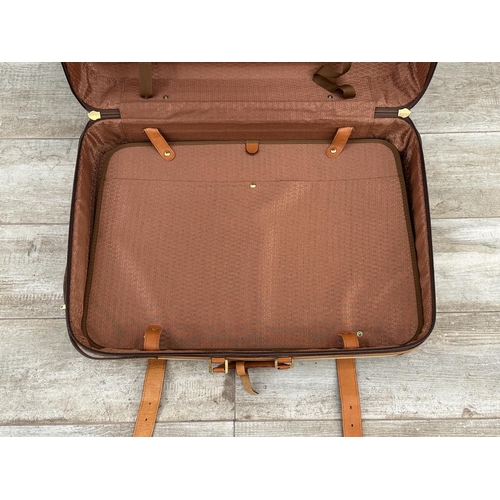 1059 - Two Italian Bojola Original Saddler cream plastic and tan leather suitcases - largest approx. 52cm h... 