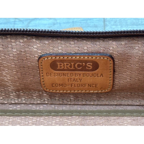 1059 - Two Italian Bojola Original Saddler cream plastic and tan leather suitcases - largest approx. 52cm h... 