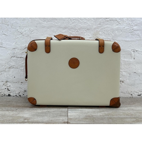 1059 - Two Italian Bojola Original Saddler cream plastic and tan leather suitcases - largest approx. 52cm h... 