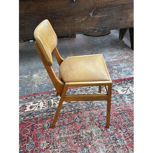 1220 - Four mid 20th century beech and tan vinyl dining chairs