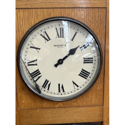 A mid 20th century Magneta oak cased electric master wall clock ...