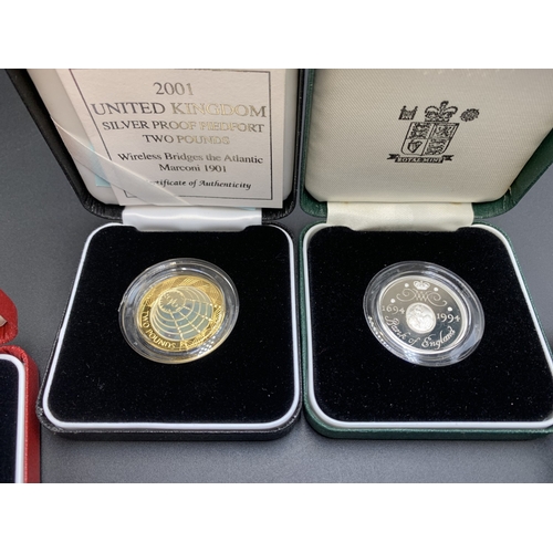 2253 - Four boxed Royal Mint .925 silver proof two pound coins with certificates of authenticity, one 1994 ... 