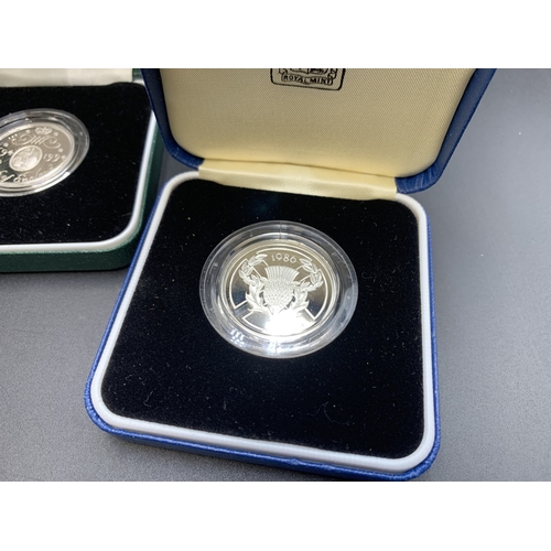 2253 - Four boxed Royal Mint .925 silver proof two pound coins with certificates of authenticity, one 1994 ... 