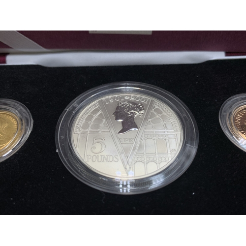 2253A - A boxed Royal Mint 1901-2001 Victorian Centenary coin collection comprising two 22ct gold sovereigns... 