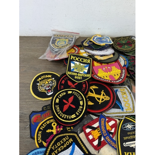 A large collection of military cloth patches