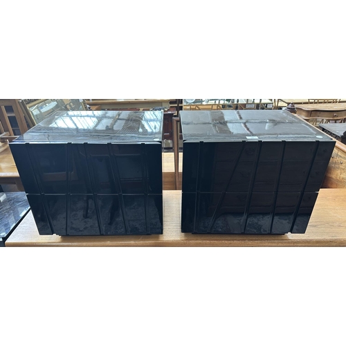142 - A pair of modern black lacquered bedside chests of drawers - approx. 45cm high x 50cm wide x 43cm de... 