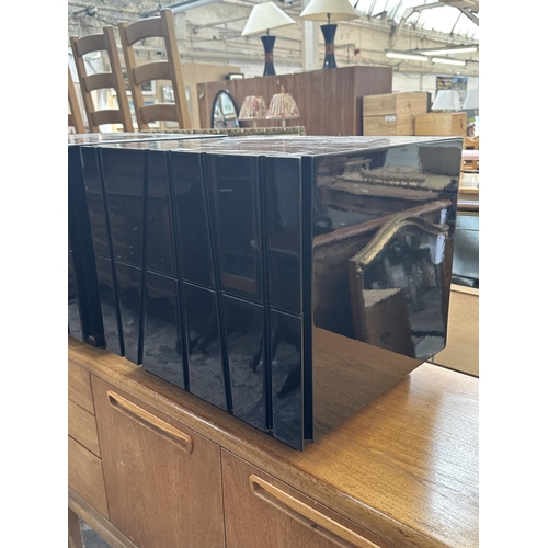 142 - A pair of modern black lacquered bedside chests of drawers - approx. 45cm high x 50cm wide x 43cm de... 