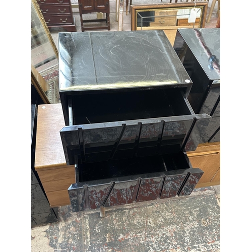 142 - A pair of modern black lacquered bedside chests of drawers - approx. 45cm high x 50cm wide x 43cm de... 