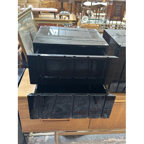142 - A pair of modern black lacquered bedside chests of drawers - approx. 45cm high x 50cm wide x 43cm de... 