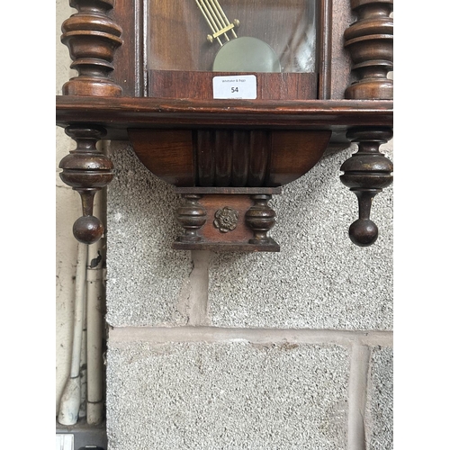 A Highlands mahogany cased chiming wall clock with pendulum and key ...