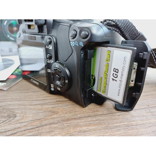 1 - A boxed Canon EOS 400D 10.1mp DSLR camera fitted with Ultrasonic EF-S 1:4-5.6 IS USM zoom lens, batt... 