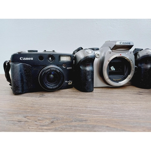 2 - Four Canon digital cameras, one EOS 300D 6mp DSLR fitted with EF-S 1:3.5-5.6 zoom lens, one EOS 300D... 
