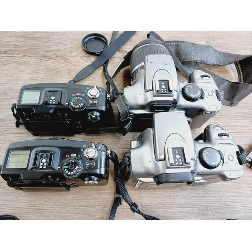 2 - Four Canon digital cameras, one EOS 300D 6mp DSLR fitted with EF-S 1:3.5-5.6 zoom lens, one EOS 300D... 
