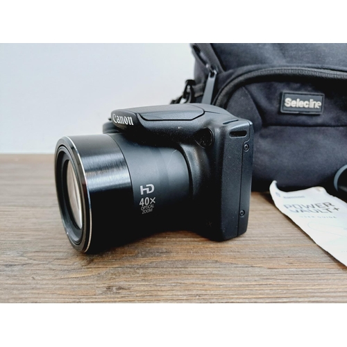 3 - Two Canon PowerShot CCD sensor compact digital cameras, one cased SX410 IS 20mp and one SX400 IS 16m... 