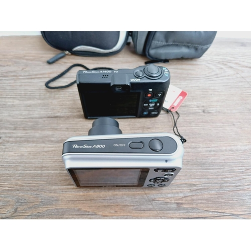 34 - Two cased Canon PowerShot CCD sensor compact digital cameras, one A1400 16mp with instruction manual... 