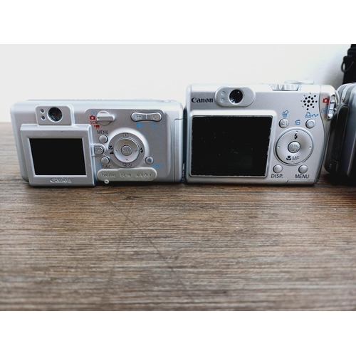 5 - Four Canon PowerShot CCD sensor compact digital cameras, one cased A710 IS 8mp, two A530 5mp and one... 