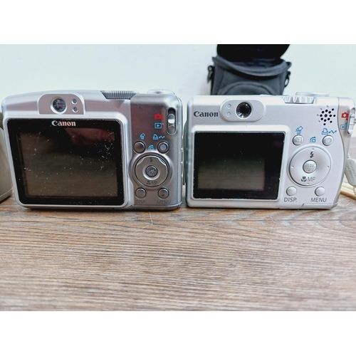 5 - Four Canon PowerShot CCD sensor compact digital cameras, one cased A710 IS 8mp, two A530 5mp and one... 
