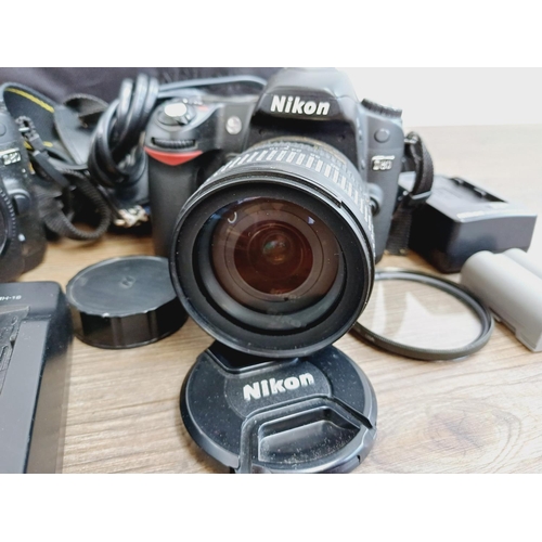 10 - A Nikon camera bag containing two Nikon D80 10mp APS-C CCD sensor DSLR cameras, one fitted with AF-S... 