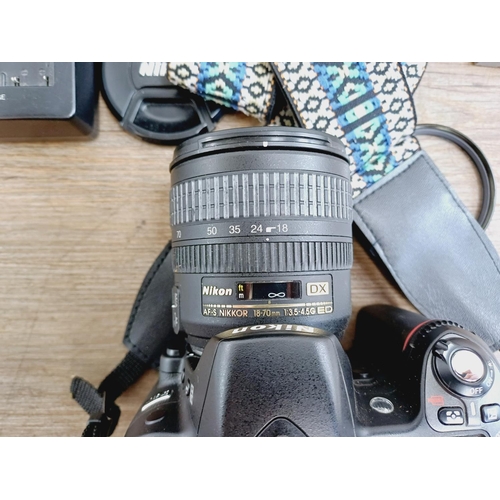 10 - A Nikon camera bag containing two Nikon D80 10mp APS-C CCD sensor DSLR cameras, one fitted with AF-S... 