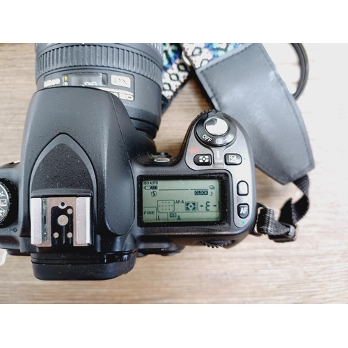 10 - A Nikon camera bag containing two Nikon D80 10mp APS-C CCD sensor DSLR cameras, one fitted with AF-S... 