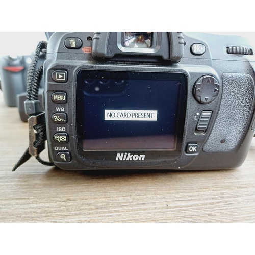 10 - A Nikon camera bag containing two Nikon D80 10mp APS-C CCD sensor DSLR cameras, one fitted with AF-S... 