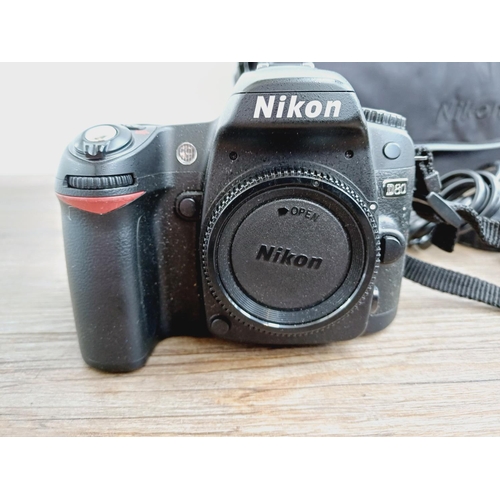 10 - A Nikon camera bag containing two Nikon D80 10mp APS-C CCD sensor DSLR cameras, one fitted with AF-S... 