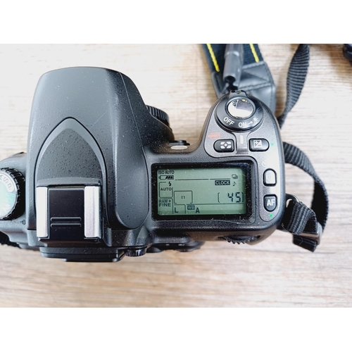 10 - A Nikon camera bag containing two Nikon D80 10mp APS-C CCD sensor DSLR cameras, one fitted with AF-S... 