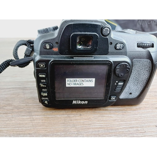 10 - A Nikon camera bag containing two Nikon D80 10mp APS-C CCD sensor DSLR cameras, one fitted with AF-S... 