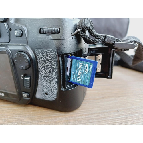 10 - A Nikon camera bag containing two Nikon D80 10mp APS-C CCD sensor DSLR cameras, one fitted with AF-S... 