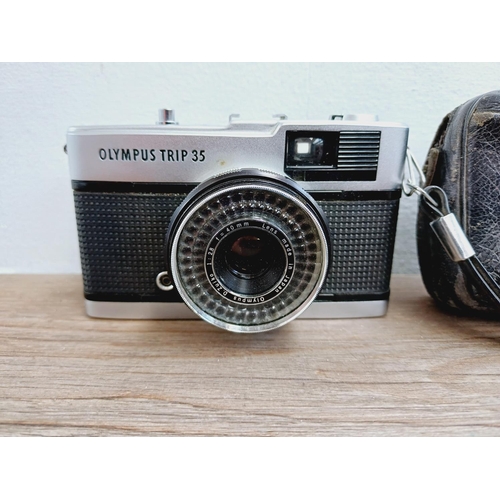 22 - A leather cased Olympus Trip 35 fully-automatic compact 35mm camera with wrist strap