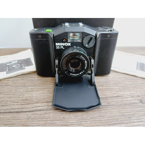 26 - A cased Minox 35 PL ultra-compact 35mm camera with instruction manual