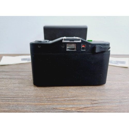 26 - A cased Minox 35 PL ultra-compact 35mm camera with instruction manual