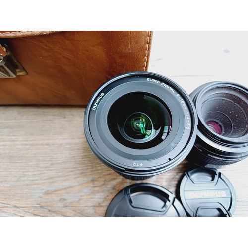 13 - A cased Olympus E-410 10mp Four Thirds CMOS sensor DSLR camera fitted with Zuiko Digital ED 1:3.5-5.... 