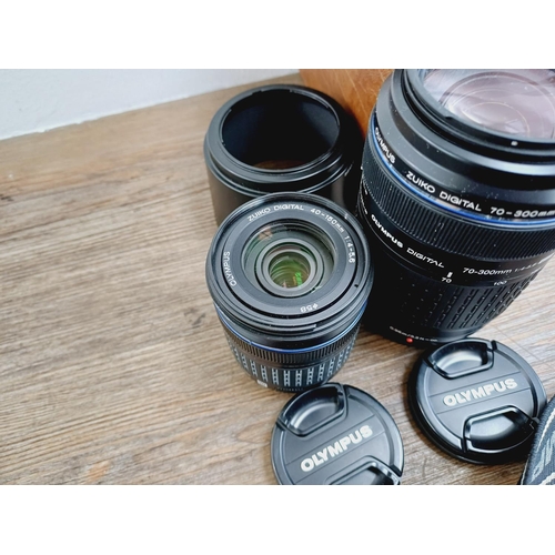 13 - A cased Olympus E-410 10mp Four Thirds CMOS sensor DSLR camera fitted with Zuiko Digital ED 1:3.5-5.... 