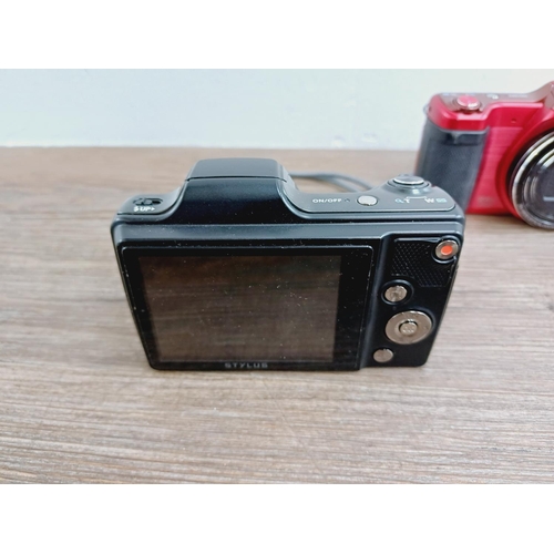 18 - Two Olympus SZ-15 16mp CCD sensor compact digital cameras