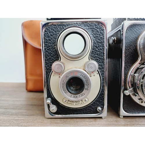 48 - Two cased Haking Halina cameras for 6x6 images on 120 film, one A1 TLR fitted with 1:3.5 80mm lenses... 