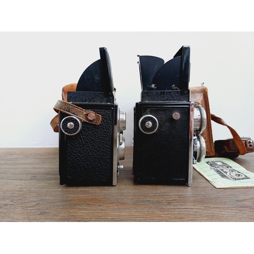 48 - Two cased Haking Halina cameras for 6x6 images on 120 film, one A1 TLR fitted with 1:3.5 80mm lenses... 