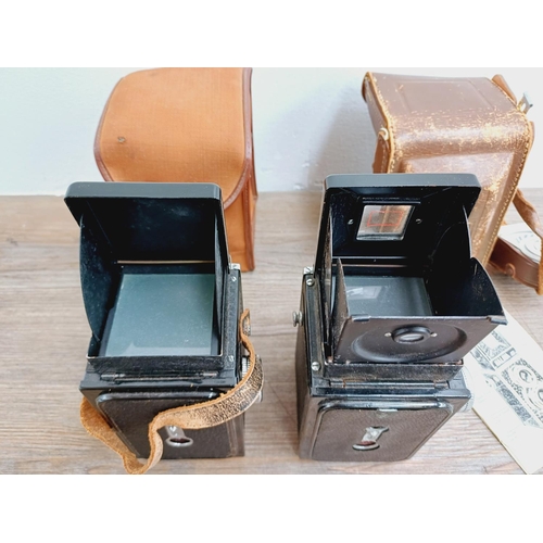 48 - Two cased Haking Halina cameras for 6x6 images on 120 film, one A1 TLR fitted with 1:3.5 80mm lenses... 