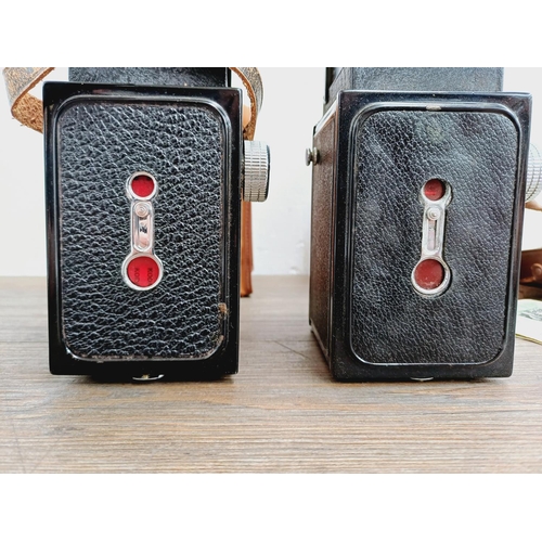 48 - Two cased Haking Halina cameras for 6x6 images on 120 film, one A1 TLR fitted with 1:3.5 80mm lenses... 