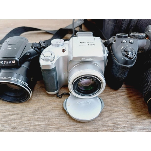 53 - Five Fujifilm FinePix digital bridge cameras to include HS25EXR 16mp CMOS sensor, S1730 12mp, S1600 ... 
