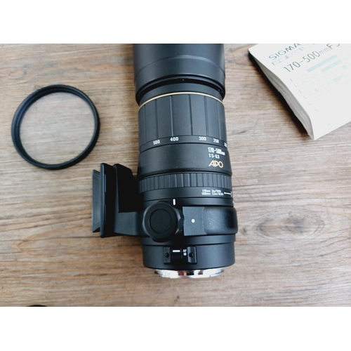 58 - A cased Sigma 1:5-6.3 170-500mm AF/MF APO Canon AF mount lens with Hoya UV filter, caps, shade and i... 