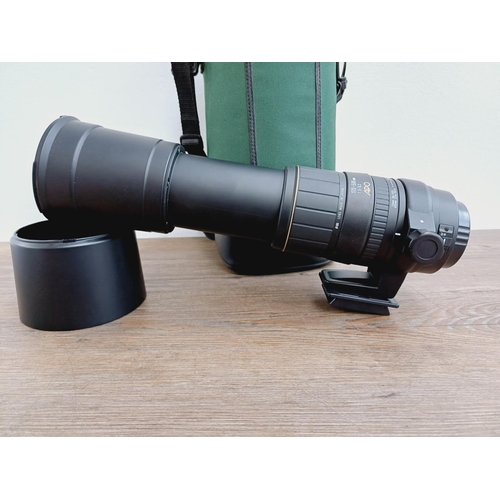 58 - A cased Sigma 1:5-6.3 170-500mm AF/MF APO Canon AF mount lens with Hoya UV filter, caps, shade and i... 