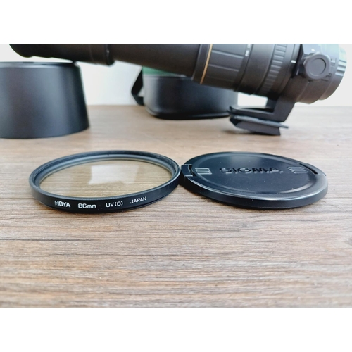 58 - A cased Sigma 1:5-6.3 170-500mm AF/MF APO Canon AF mount lens with Hoya UV filter, caps, shade and i... 