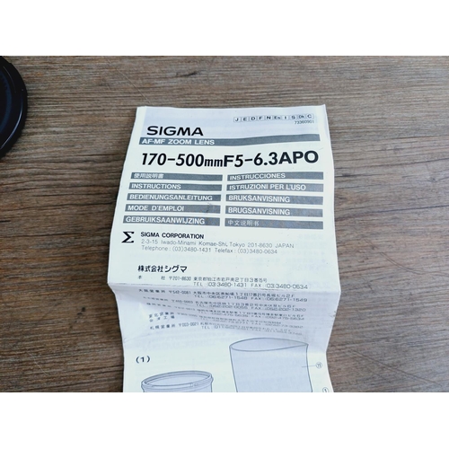 58 - A cased Sigma 1:5-6.3 170-500mm AF/MF APO Canon AF mount lens with Hoya UV filter, caps, shade and i... 
