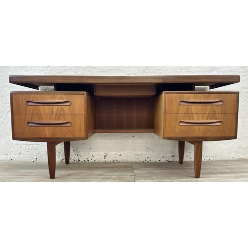 1152 - A mid 20th century G Plan Fresco teak floating top dressing table - approx. 70cm high x 152cm wide x... 