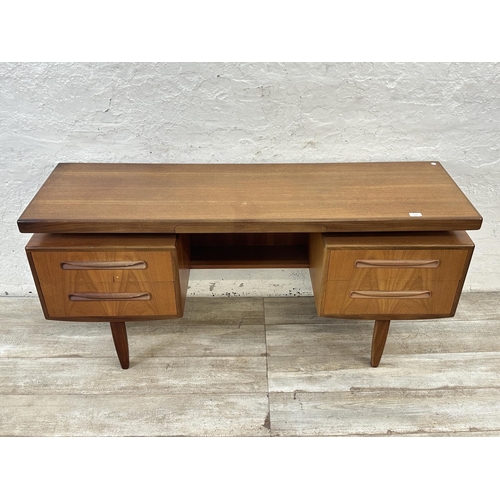 1152 - A mid 20th century G Plan Fresco teak floating top dressing table - approx. 70cm high x 152cm wide x... 