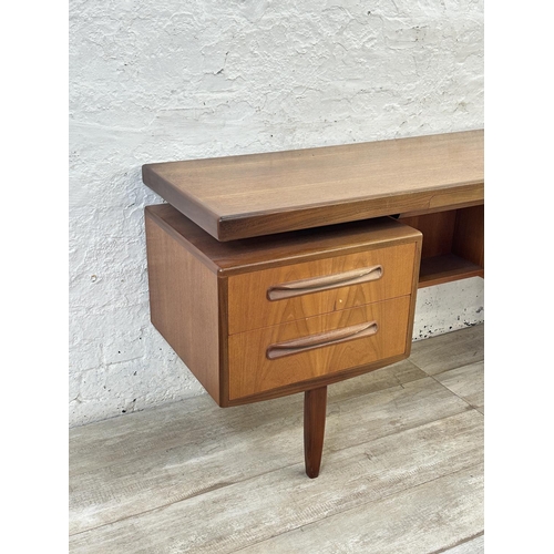1152 - A mid 20th century G Plan Fresco teak floating top dressing table - approx. 70cm high x 152cm wide x... 