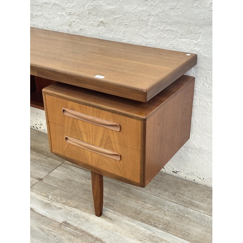 1152 - A mid 20th century G Plan Fresco teak floating top dressing table - approx. 70cm high x 152cm wide x... 